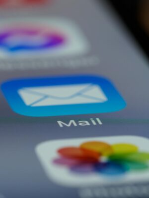 Detailed close-up of an email app icon on a smartphone screen, showcasing modern technology.